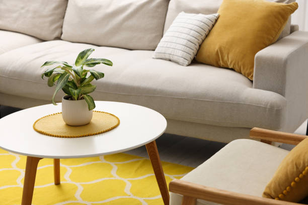 istock Spring atmosphere. Coffee table with potted plant, comfy sofa and armchair indoors 1775123269