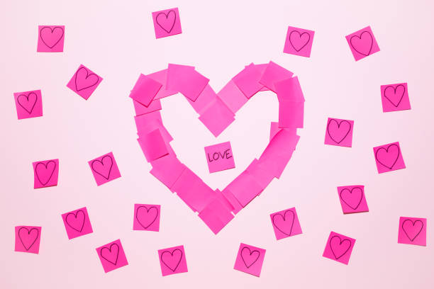 istock Pink Heart Shape Pattern on a Wall Valentine's Day Background 1775124363