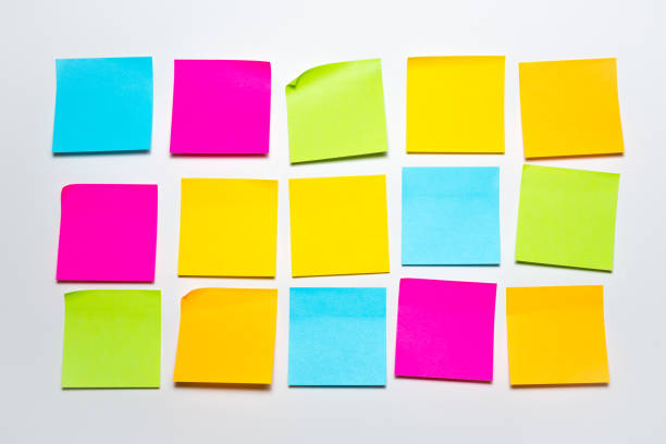 Colorful Stick Notes on a White Wall Office Supplies Background