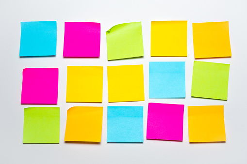Set of colorful blank sticky notes office supplies background. Empty sticky notepad paper copy space collection stuck on wall.