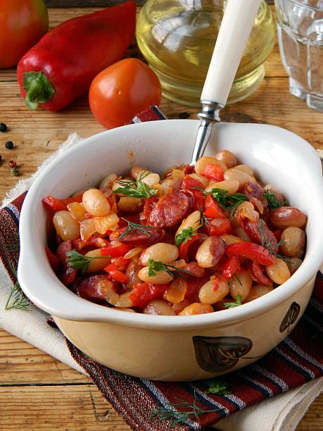 istock Beans stewed with tomatoes and smoked sausages 177513235
