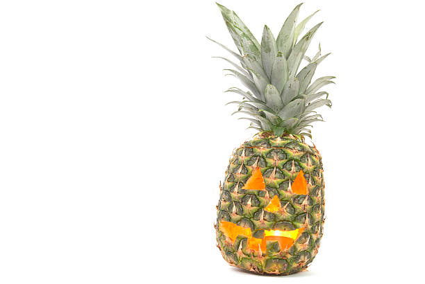 Tropical Jack-o-Lantern made out of Pineapple stock photo