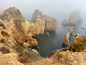 Portugal - Algarve - Lagos - Ponta Da Piedade with fog