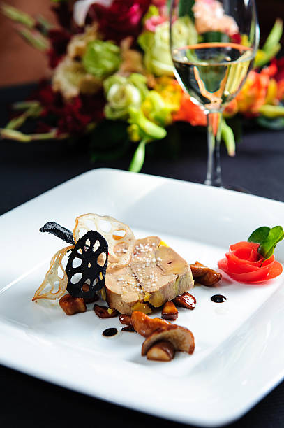 istock Goose liver on white plate with red rose garnish 177515158