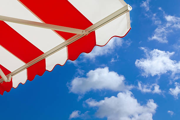 Awning over bright sunny blue sky stock photo