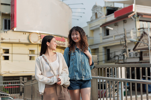 Young Asian Lgbt couple travel and look the old building in Bangkok
