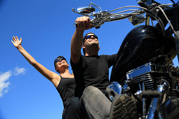 istock Couple Riding On Motorcycle In A Beautiful Summer Day 177516199