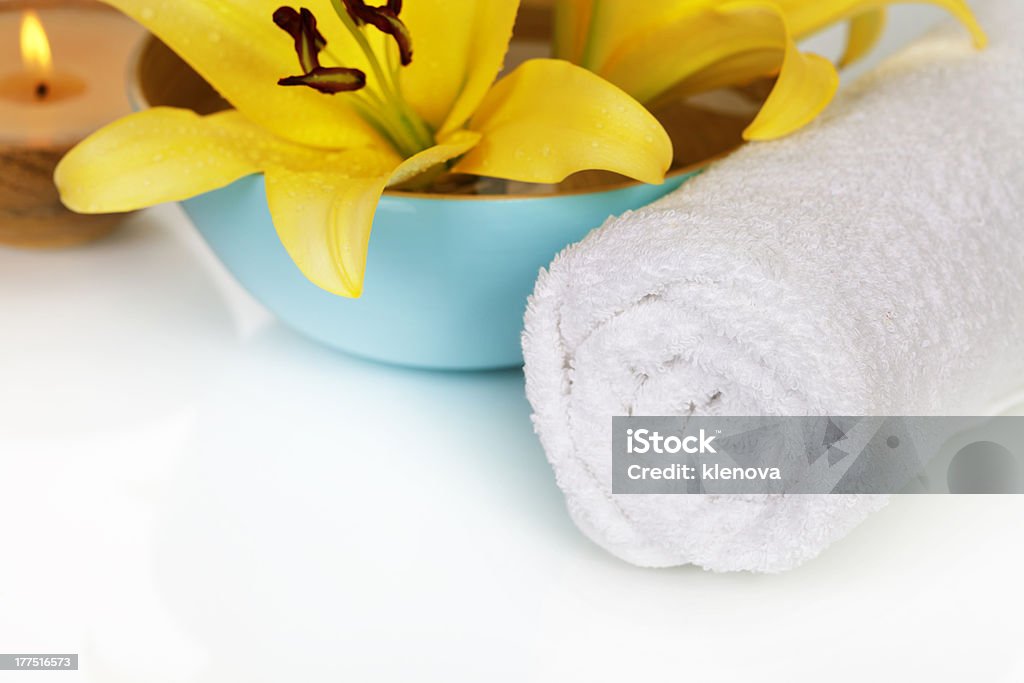 Spa composition Spa concept (flowers, towel and candle) over white Alternative Therapy Stock Photo