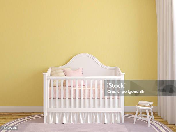 White Crib In The Interior Of A Yellow Baby Nursery Stock Photo - Download Image Now