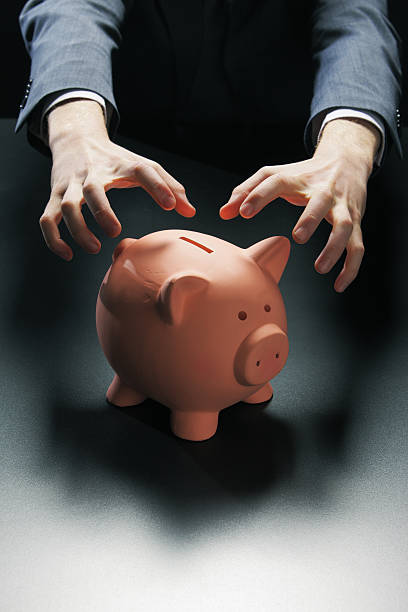 istock Robbing the Piggy Bank 177516981