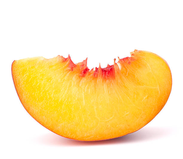 Slice of ripe peach fruit on white background