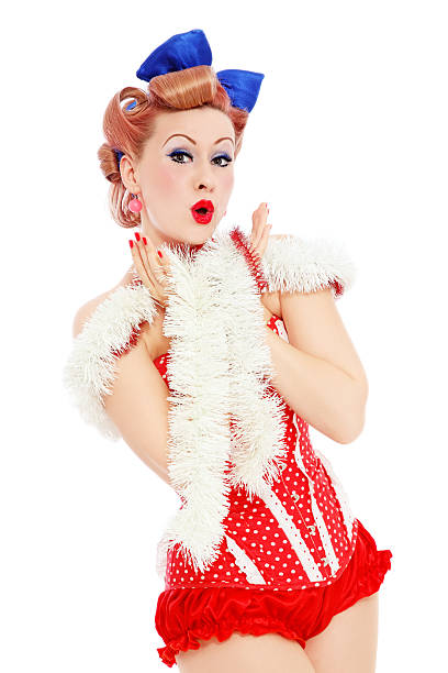 New Year coming soon! "Young beautiful sexy surprised pin-up girl in red corset, over white background" 40s pin up girls stock pictures, royalty-free photos & images