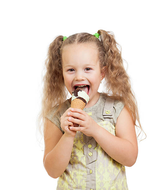 istock little curly girl eating ice cream in studio 177517706
