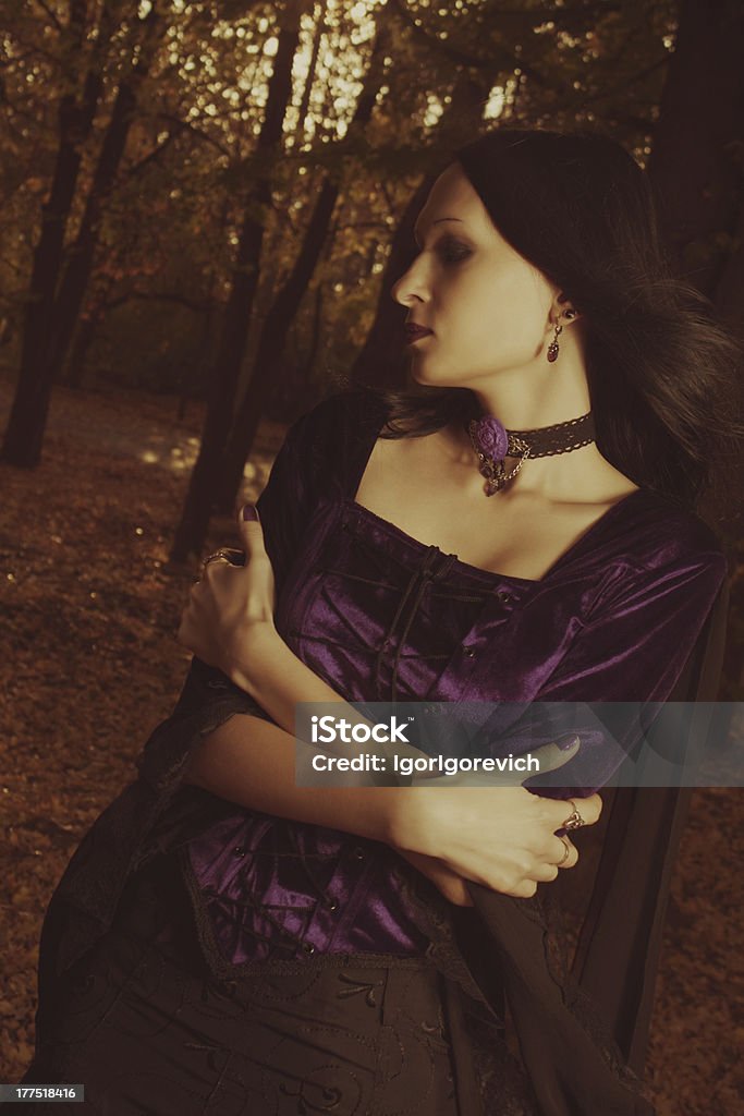 Autumn mood Pretty gothic girl standing in the forest Adult Stock Photo