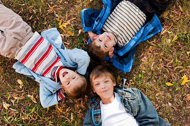 istock Portraits of the boys lying on grass 177519736