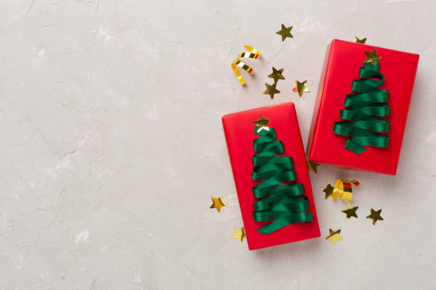 istock Creative handmade christmas gift boxes with decor on concrete background, top view 1775201807
