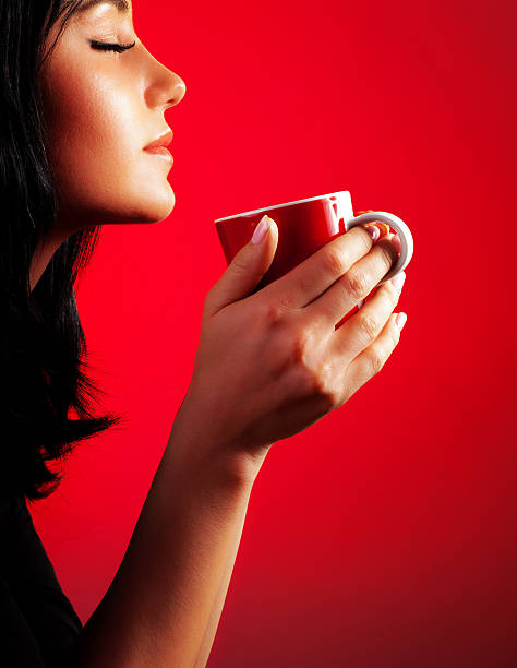Beautiful lady drinking coffee stock photo