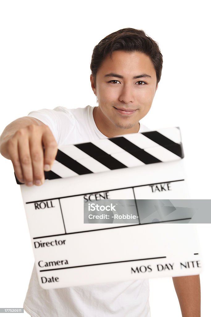 Hombre que agarra un claqueta de cine - Foto de stock de Accesorio teatral libre de derechos