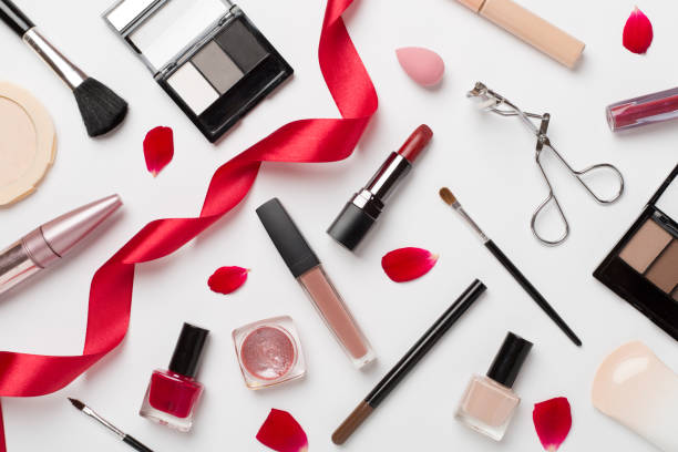istock Flat lay with makeup products and tools with flowers on color background 1775206263