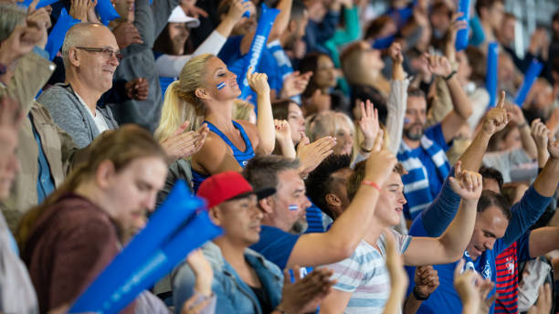 istock Spectators cheering in stadiumSpectators cheering in stadium 1775209008