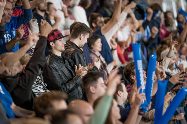 istock Spectators cheering in stadiumSpectators cheering in stadium 1775209023