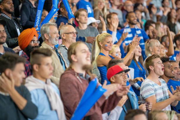 istock Spectators cheering in stadiumSpectators cheering in stadium 1775209543