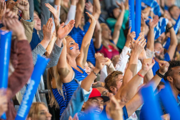 istock Spectators cheering in stadiumSpectators cheering in stadium 1775209562
