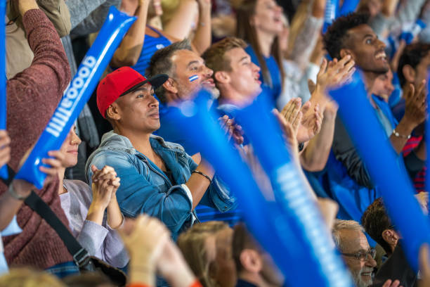 istock Spectators cheering in stadiumSpectators cheering in stadium 1775209564