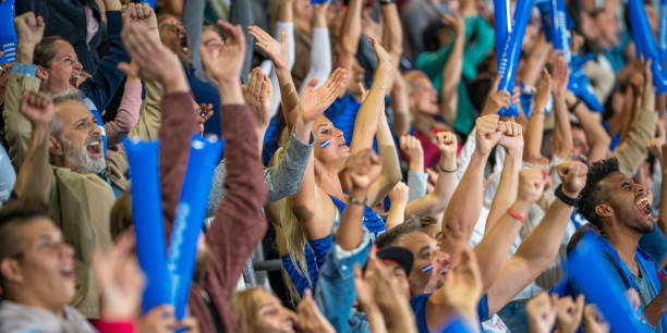 Spectators cheering in stadiumSpectators cheering in stadium