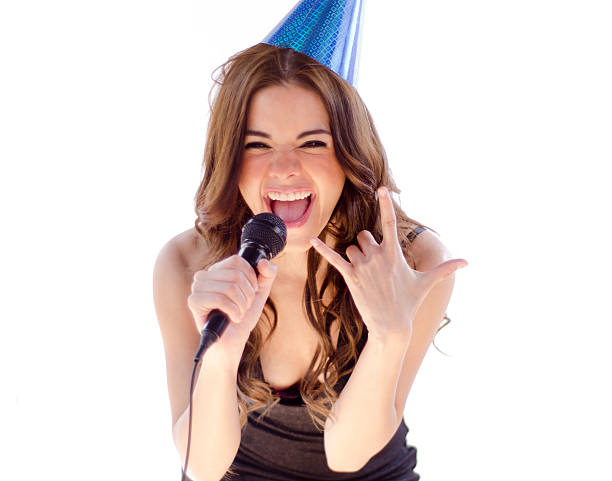 istock Beautiful young woman singing karaoke 177521248