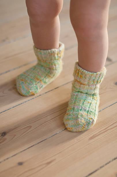 istock Baby's Feet in Hand Knitted Socks 177521464