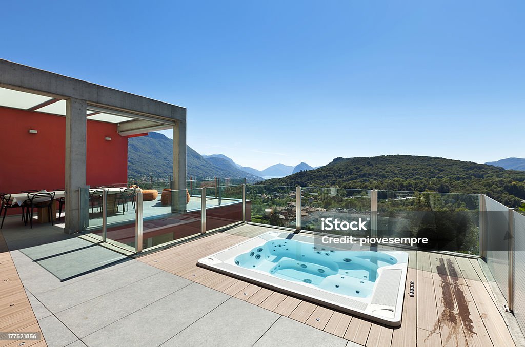 beautiful house, patio "beautiful house, modern style, view from the patio" Hot Tub Stock Photo