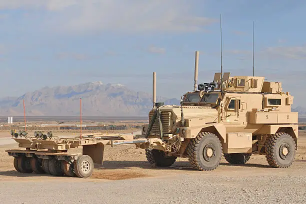 The MAXPRO version of the MRAP with the sparks mine roller attached in the desert of Afghanistan.