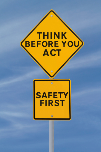A road sign indicating a safety reminder or saying (against a blue sky background) applicable to workplace safety