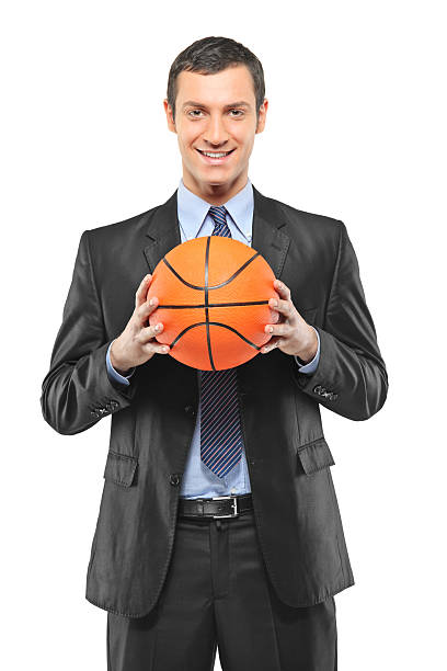 istock Smiling businessman holding a basketball 177523257