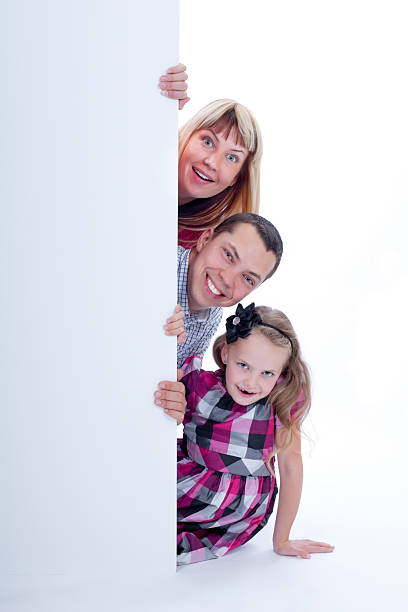 istock Family peek out surprised and smiling 177523498