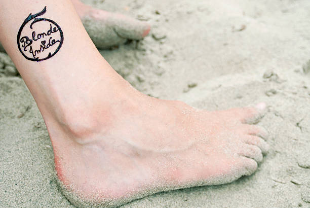 Logo Tattoo Stock Photo - Download Image Now - Ankle, Tattoo, Adult - iStock Logo Tattoo Stock Photo - Download Image Now - Ankle, Tattoo, Adult - iStock