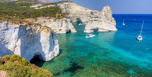 A stunning view of Kleftiko Milos Island Cyclades Greece Panoramic view of the pictorial Kleftiko cove located at the south coast of Milos island, Cyclades, Greece cyclades islands stock pictures, royalty-free photos & images
