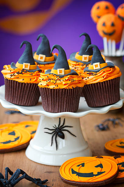 A plate of halloween cupcakes with orange frosting Cupcakes for a halloween partyMore from my portfolio - halloween cupcake stock pictures, royalty-free photos & images