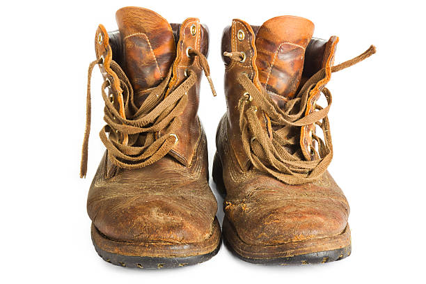 istock Pair of brown leather work boots on white 177524277