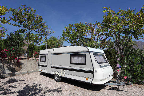 Caravan on a camping site Caravan on a camping site in SpainSEE MY OTHER CAMPING PICTURES RV truck stock pictures, royalty-free photos & images