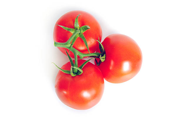 istock Three juicy, freshly washed tomatoes on white background 177524812
