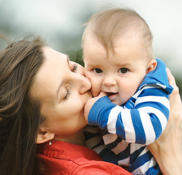 istock Mother is kissing her son 177525232