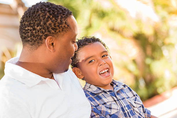 istock Happy Mixed Race Father and Son Talking 177525664