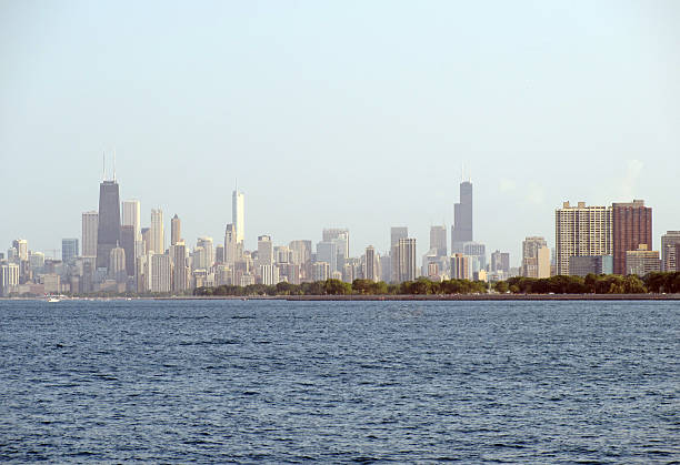 Chicago Pollution A pollution haze covers the skyline of Chicago from a distance.  Smoggy air quality. chicago smog stock pictures, royalty-free photos & images