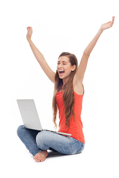 istock Woman sitting with laptop, arms raised 177526040