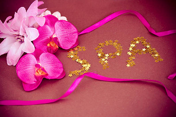istock pink orchid flowers and spa writing 177526074