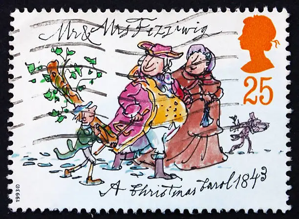 "GREAT BRITAIN - CIRCA 1993: a stamp printed in the Great Britain shows Mr. and Mrs. Fezziwig, Christmas carol by Charles Dickens, circa 1993"