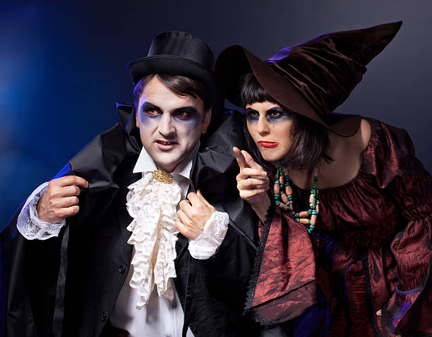 two people  wearing  as  vampire and witch. Halloween stock photo