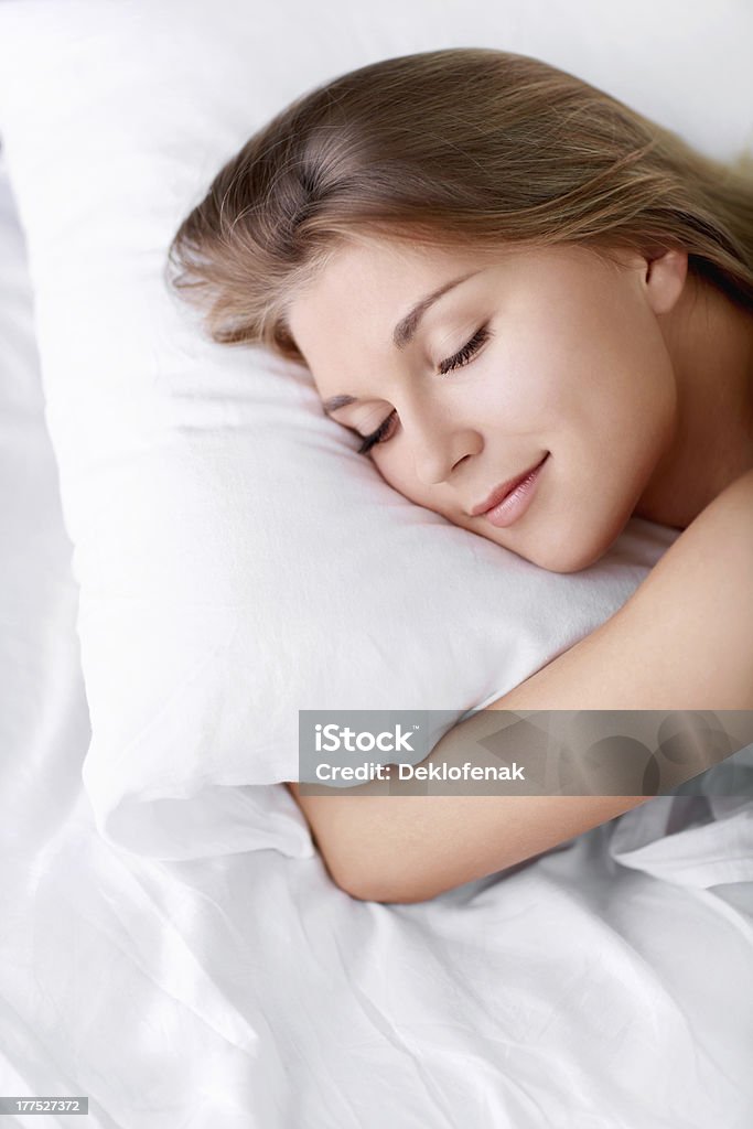 Dreams Young girl sleeping in bed 20-29 Years Stock Photo